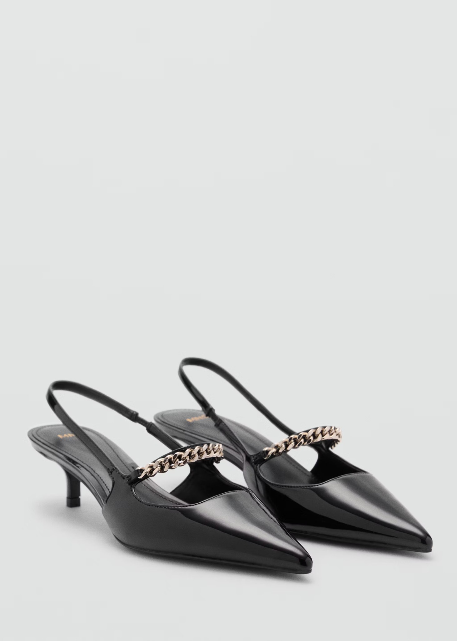 Black pointed slingback pumps with chain straps