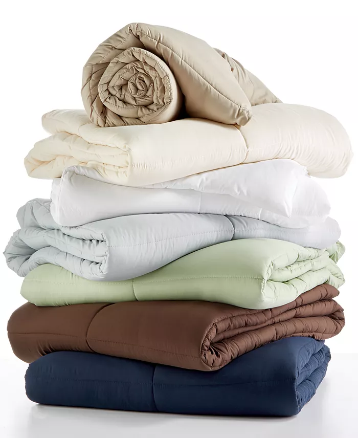 Stack of Royal Luxe down alternative comforters in several colors